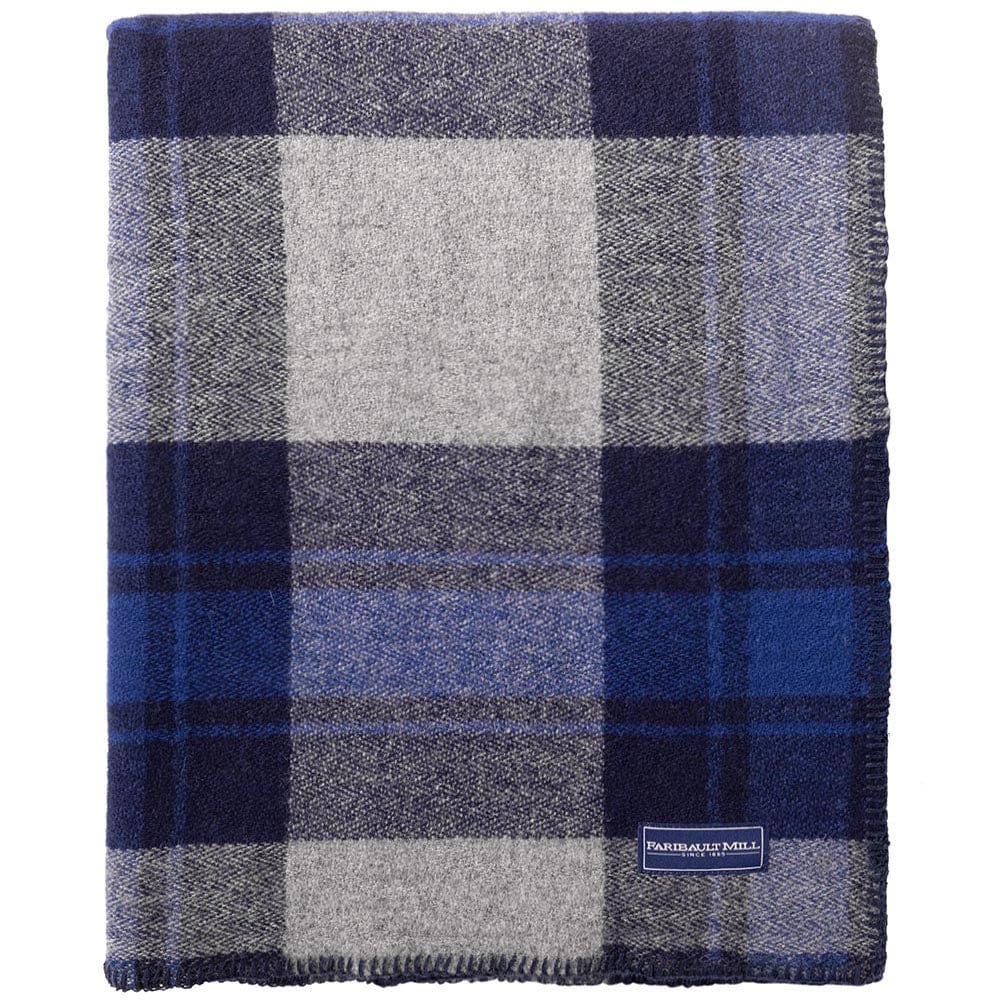 Faribault Mill North Shore blue middleweight wool bed blanket, folded and displayed in a top-down view.