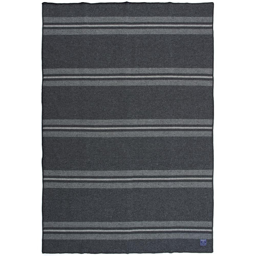 Faribault Mill Cabin charcoal middleweight wool throw, unfolded and laid flat in a top-down view.