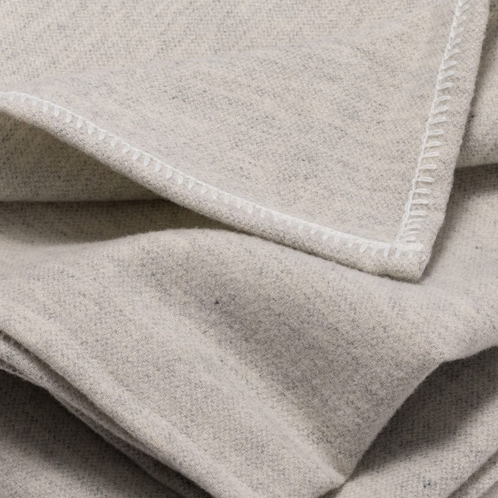 Faribault Mill Lakefront natural lightweight wool bed blanket, displayed close-up showing the weave, texture, and edge finish.