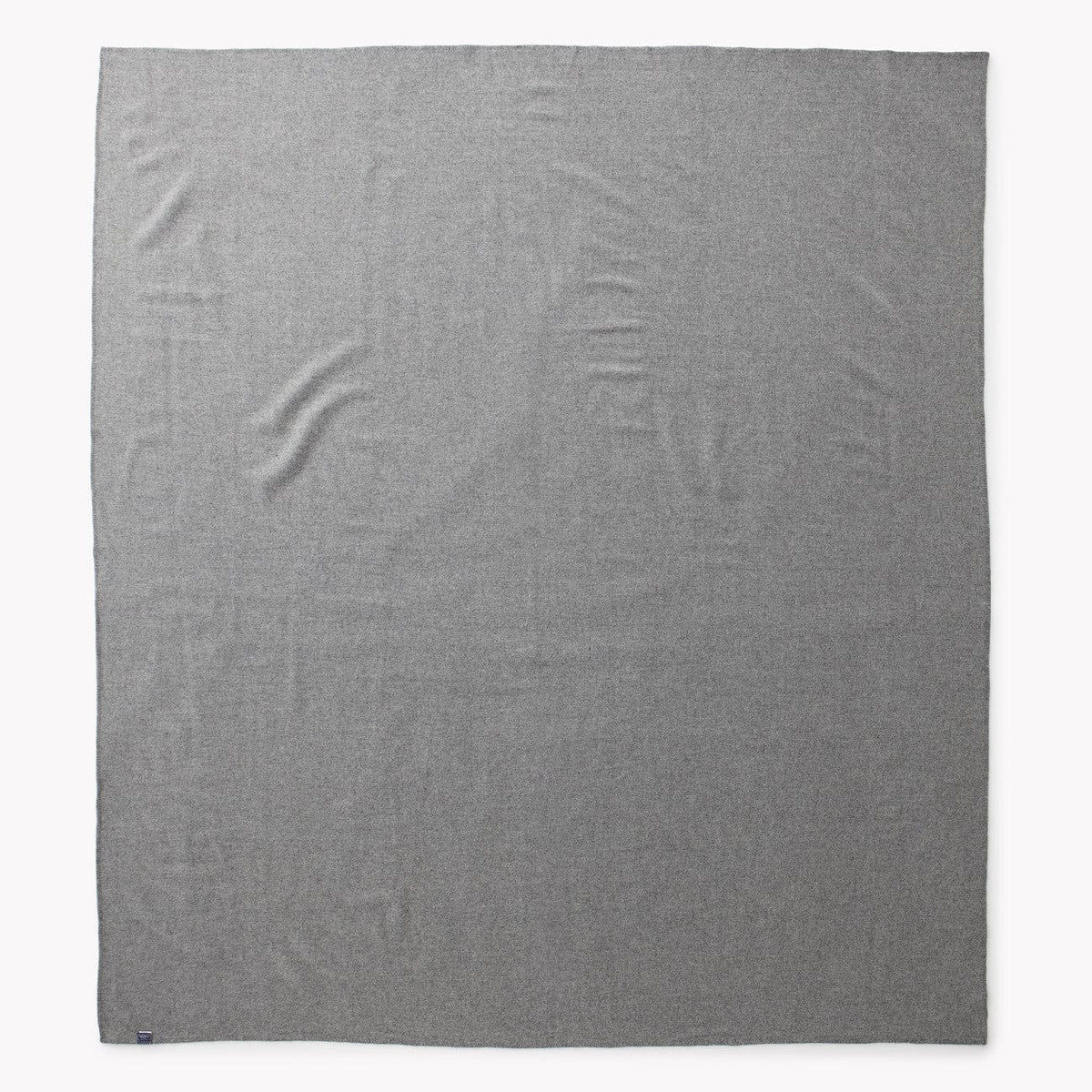 Faribault Mill Pure and Simple heather gray middleweight wool bed blanket, unfolded and laid flat in a top-down view.