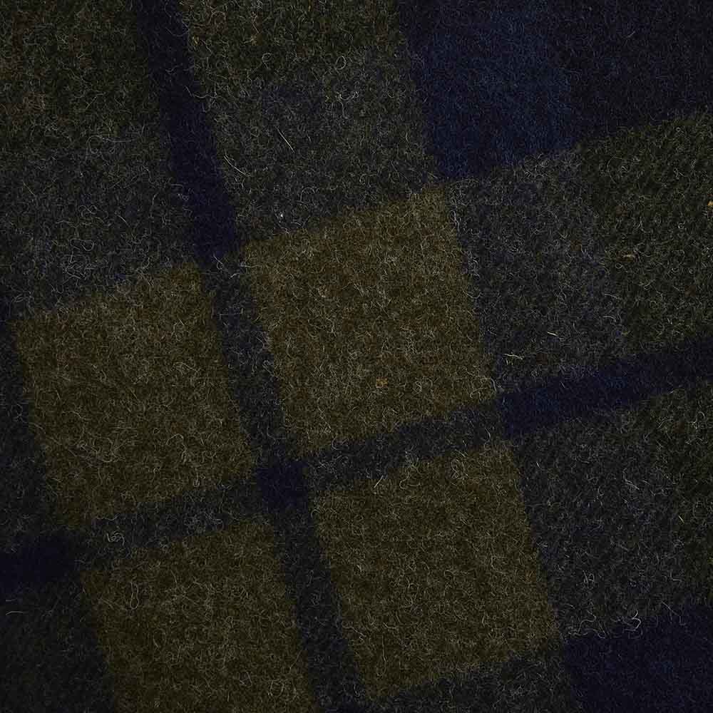 Faribault Mill Shadow Plaid green middleweight wool bed blanket, displayed close-up showing the weave and texture detail.